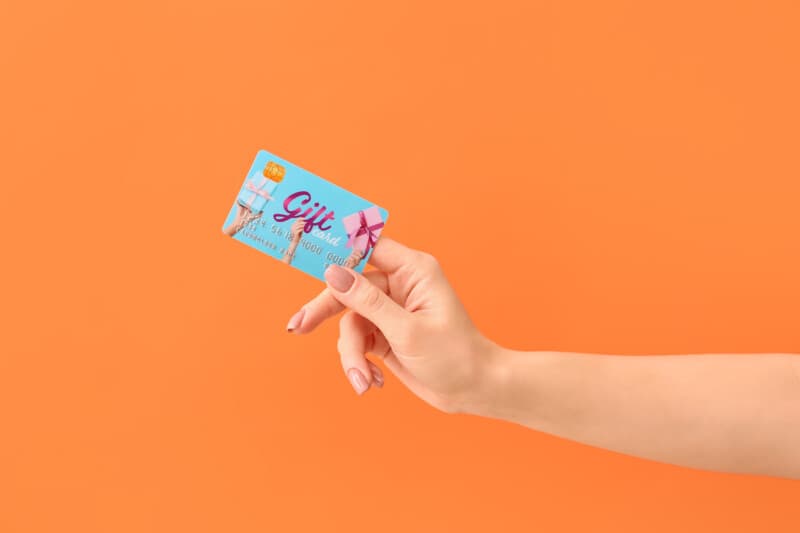 Woman holding a gift card