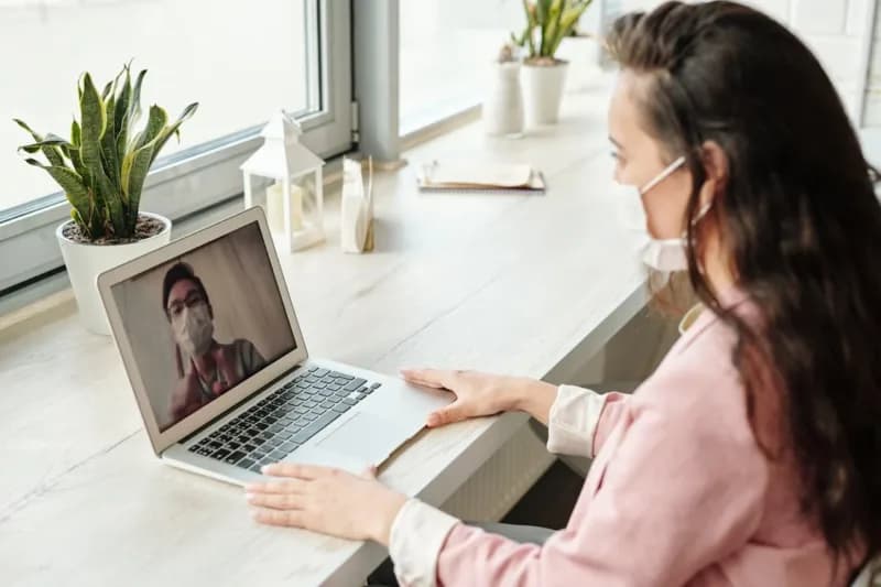 A woman in isolation while working from home