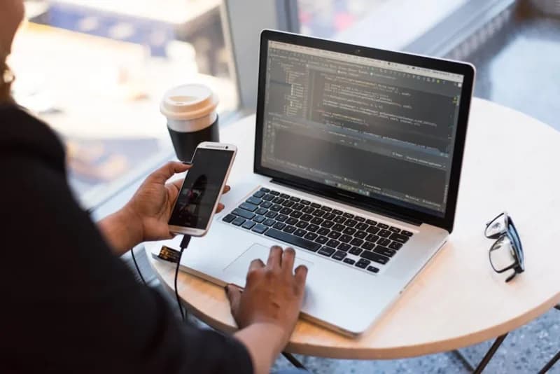 A web developer working on his laptop