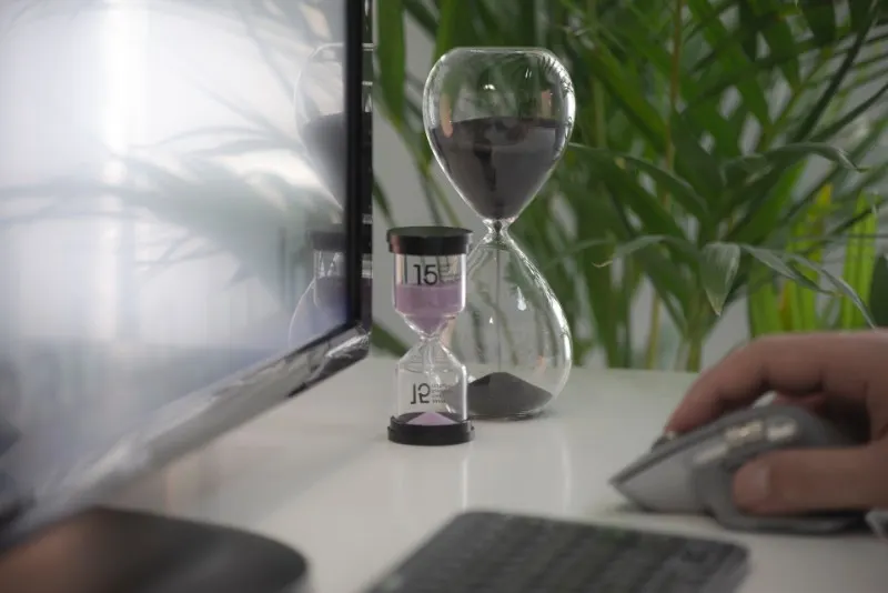 Two Hourglasses Beside A Computer, Time Management