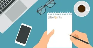 Writing On A Memo Pad With Lifepoints Logo