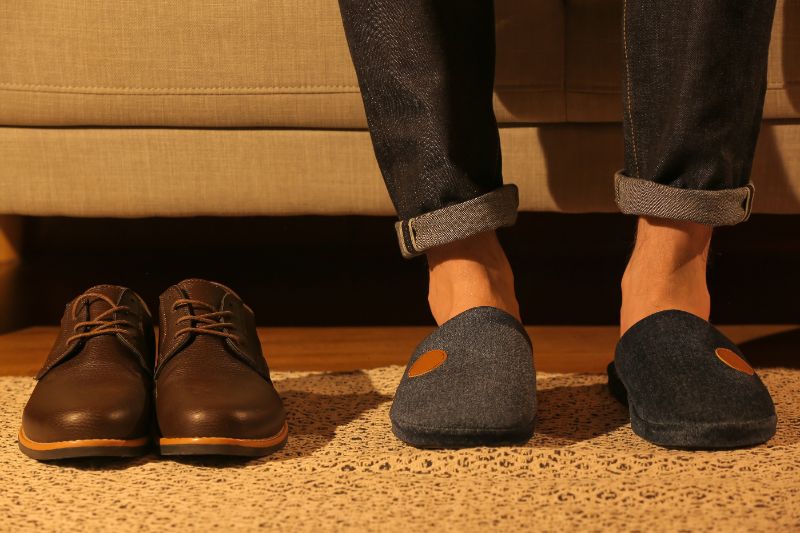 Man wearing soft slippers at home