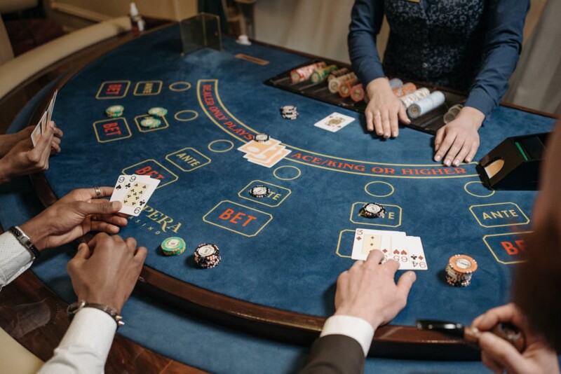 Four people gambling at a casino table